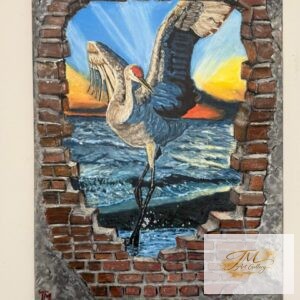 Bird flying over ocean sunset